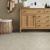 Pamplona gluedown lvt floors complement the warm vanity in a bathroom