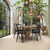 Light-filled dining room with Sabbia Ceppo LM44 floors from the Art Select collection