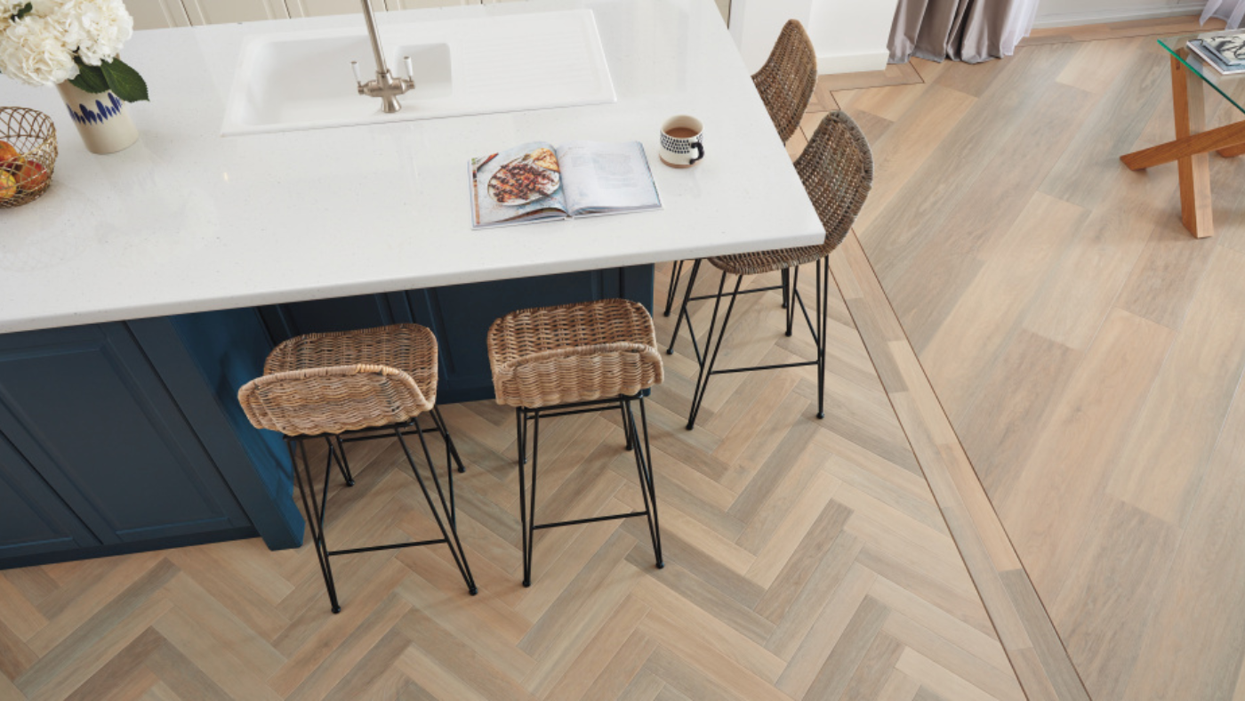 Karndean Mountain Oak herringbone wood flooring in an open plan kitchen and living room