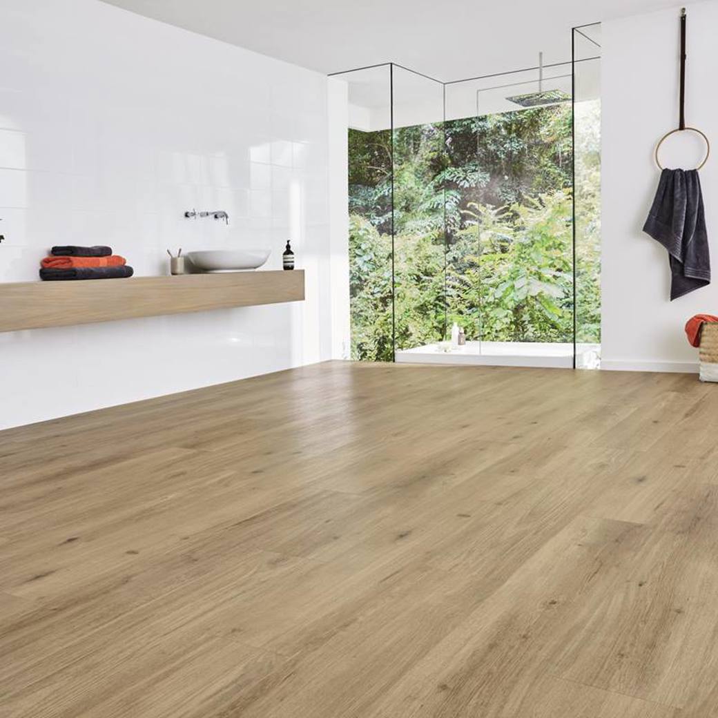 Van Gogh Canadian Urban Oak mid brown LVT flooring laid in a bathroom
