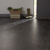 Van Gogh Canadian Urban Oak mid brown LVT flooring laid next to some shoes