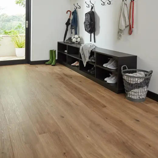 Van Gogh Canadian Urban Oak mid brown LVT flooring laid in a hallway passage