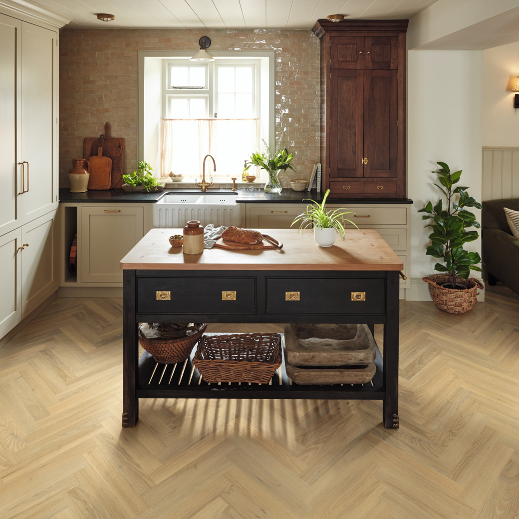 Wells Acacia light brown herringbone LVT laid in a kitchen
